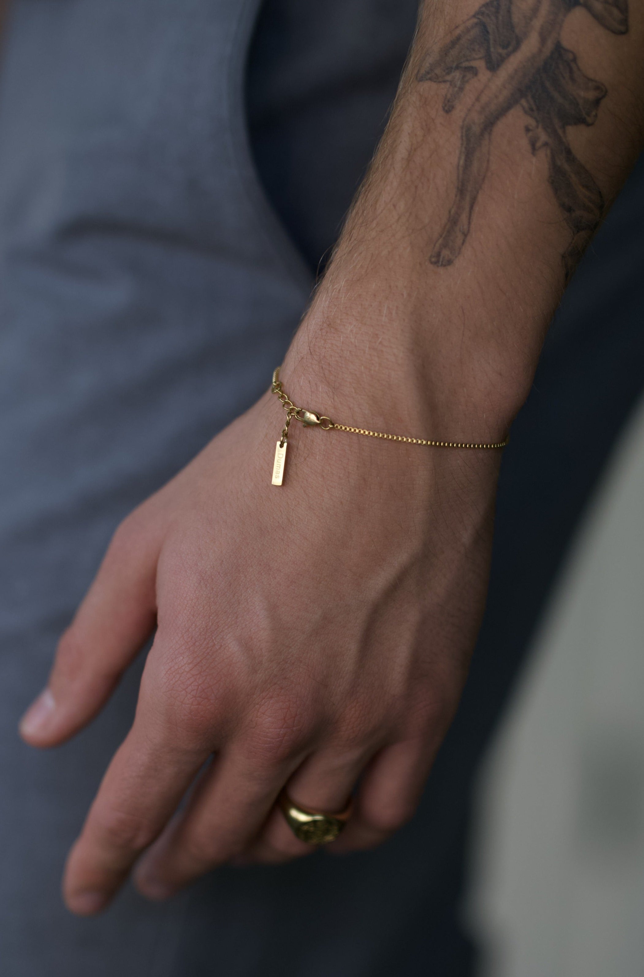 gold bracelet on wrist man