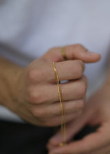 Gold chain in hand