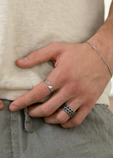 man wearing silver adjustable ring