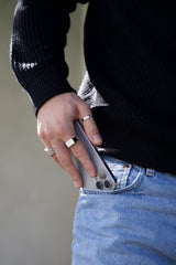 man wearing silver rings