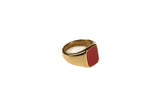 gold ring with red gemstone