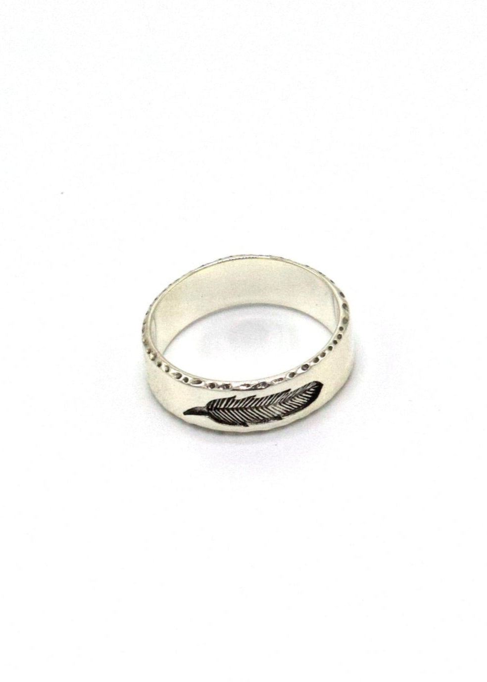 silver ring with feather and textured ring